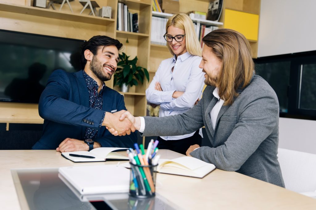 Businessmen handshaking after deal agreement