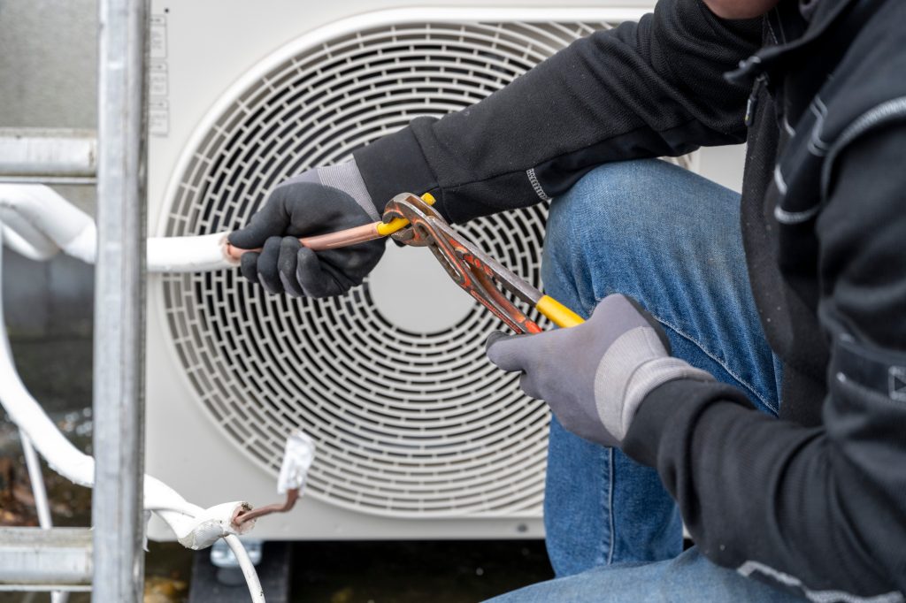 Technician at work on an HVAC unit.